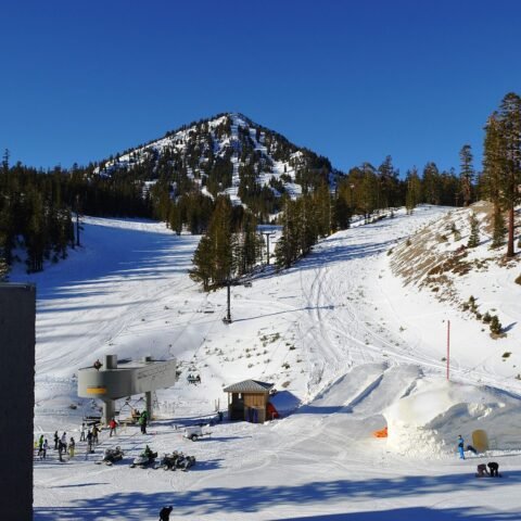 Ski slope below a snowy peak